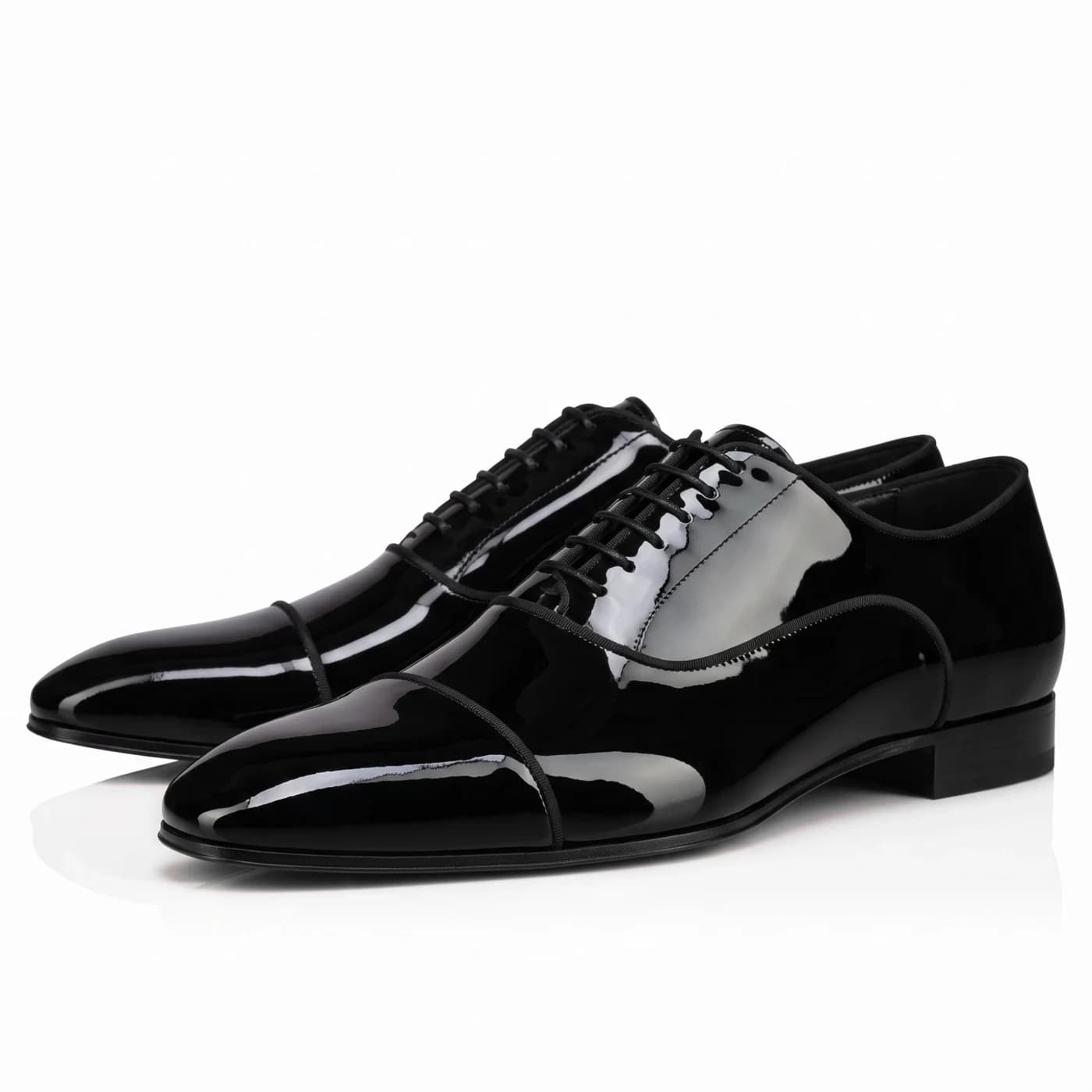 Pair of black patent leather cap toe oxfords