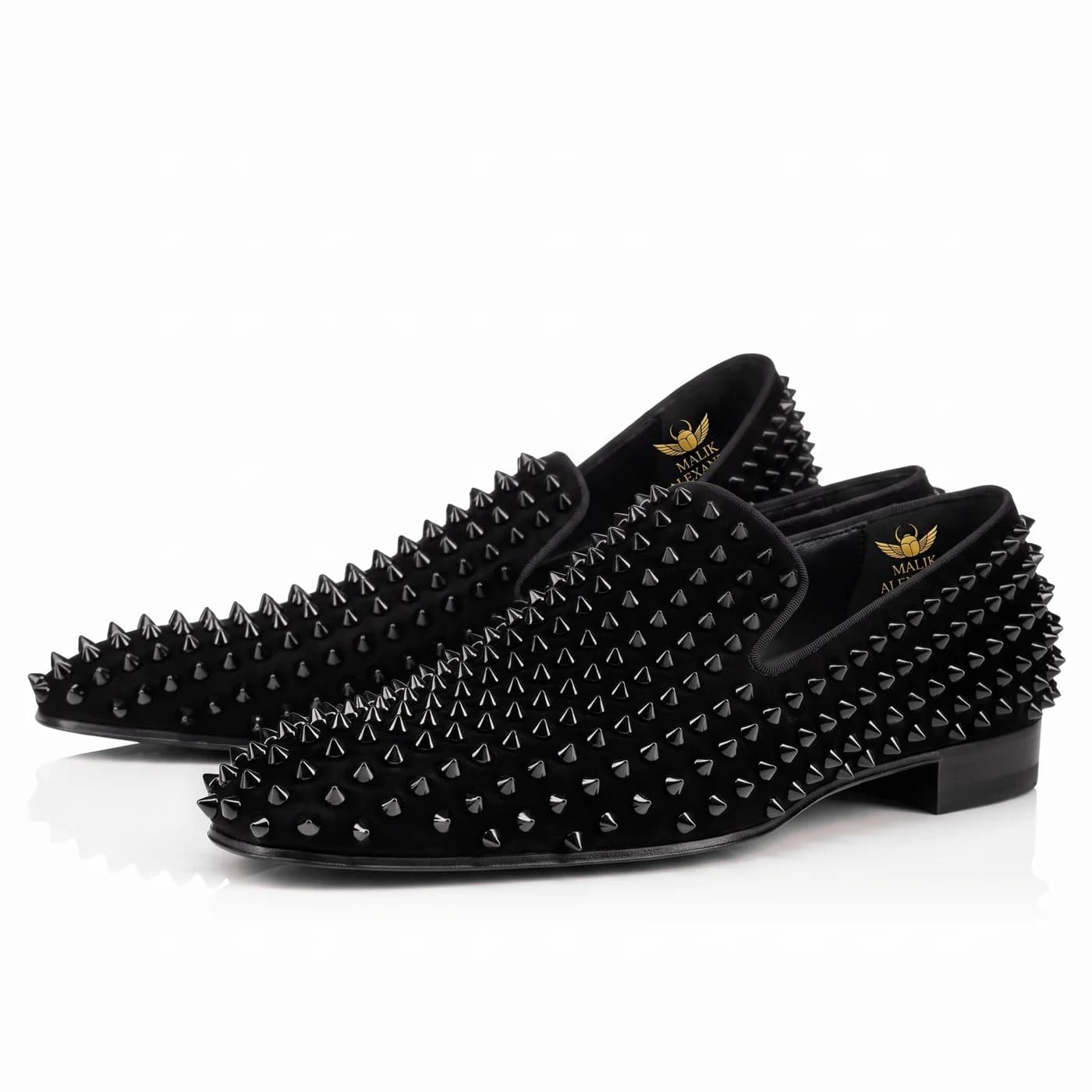 A pair of black spiked loafers