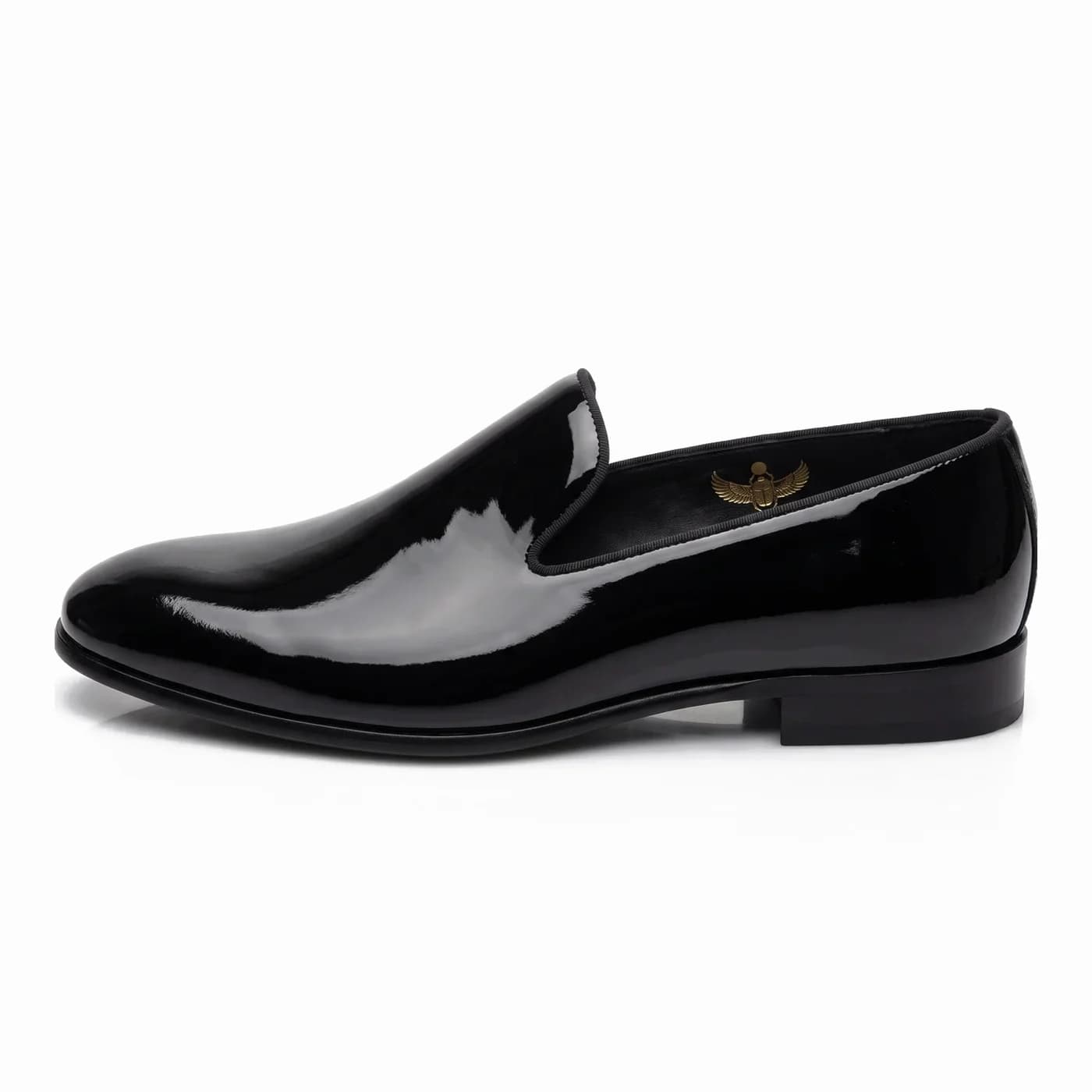 Patent slipper, black, in side profile with a black sole
