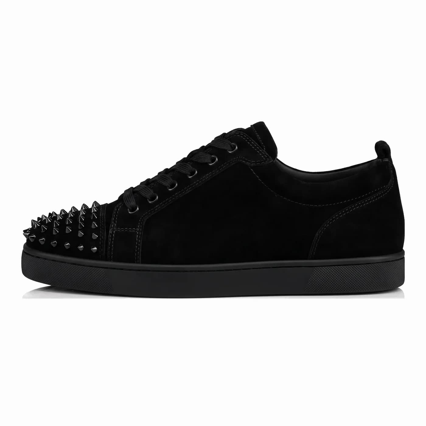 Spiked low top, black, in side profile with a black sole
