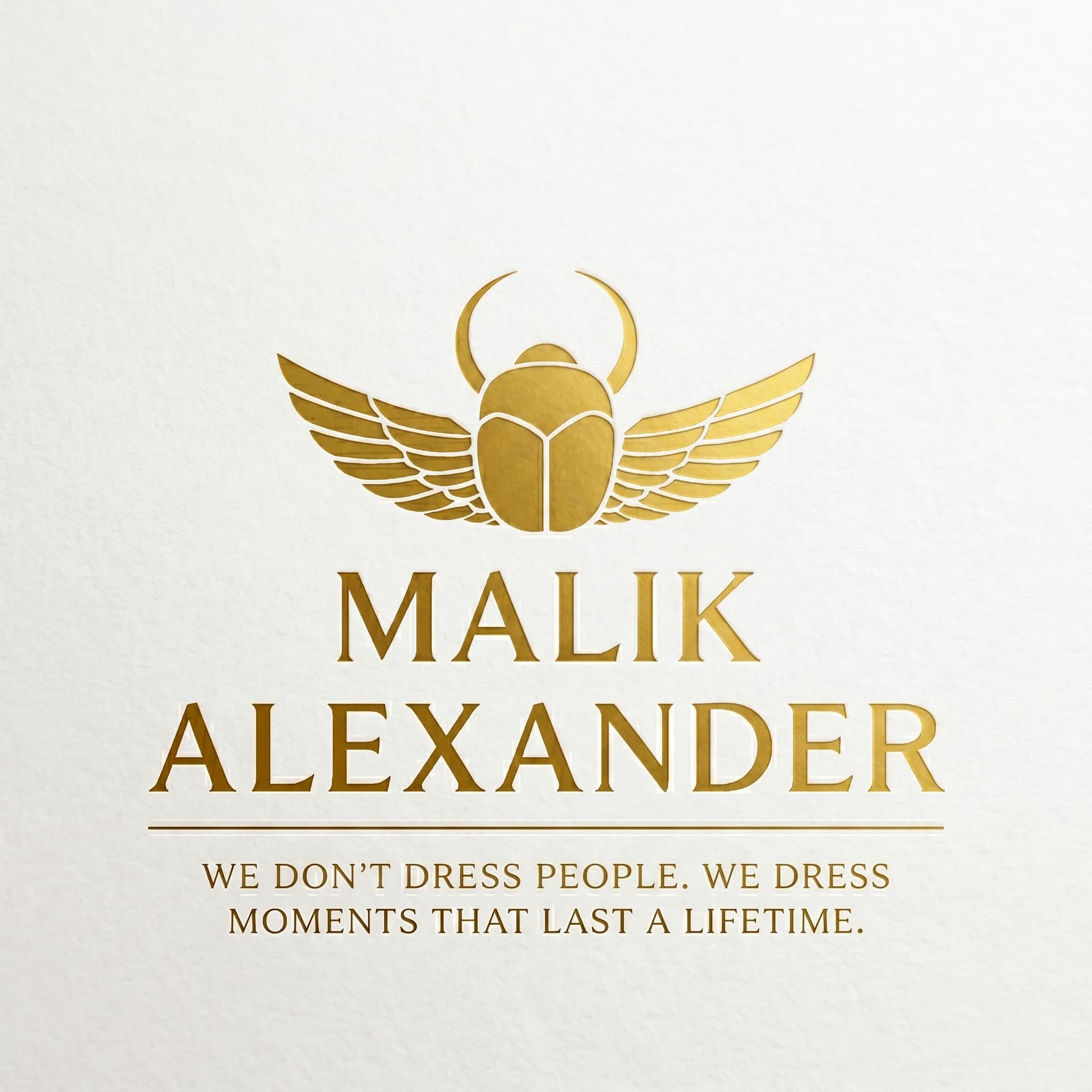 Malik Alexander gold scarab emblem and brand motto on white