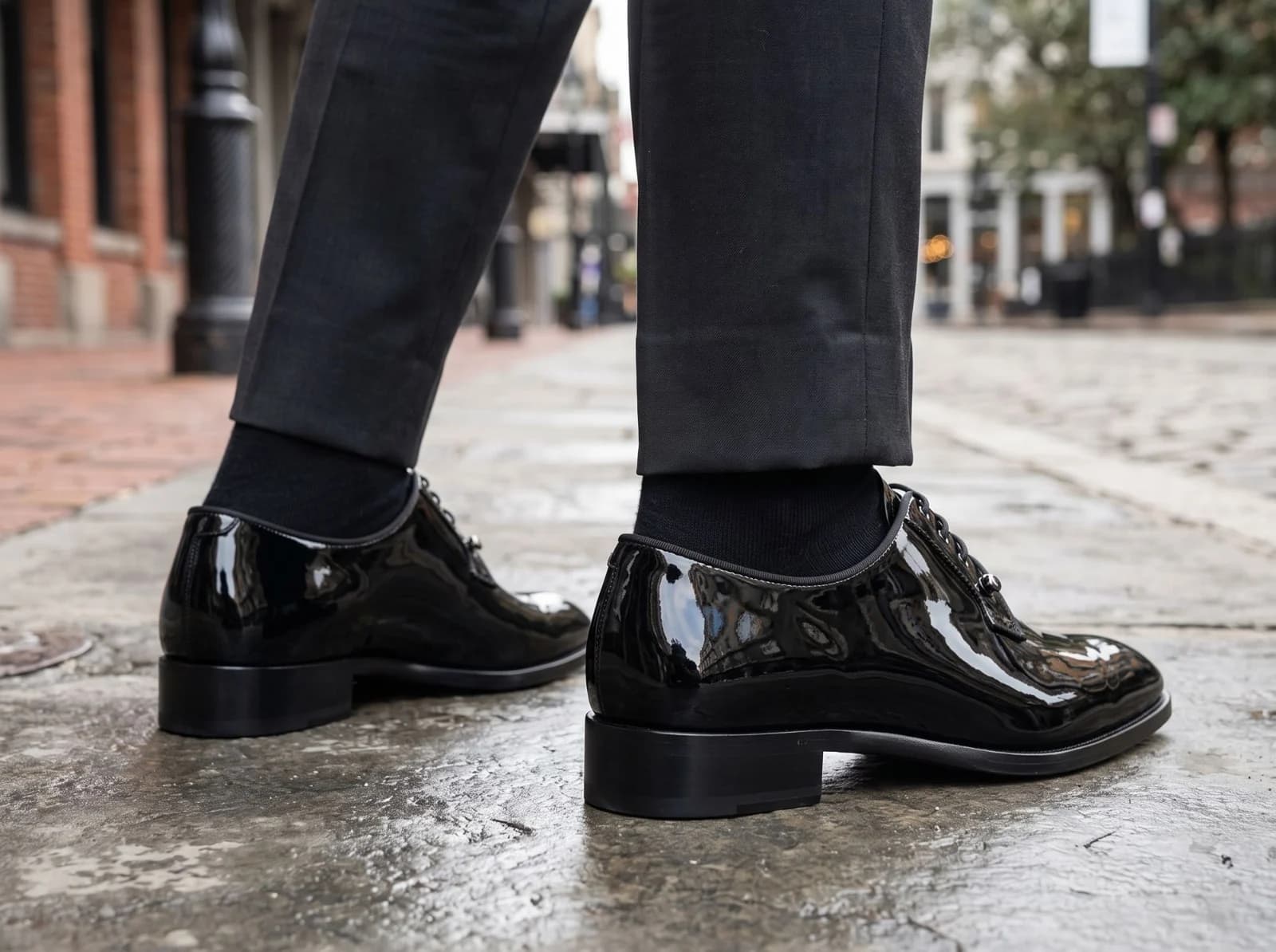 Patent derbys from behind on a wet city street