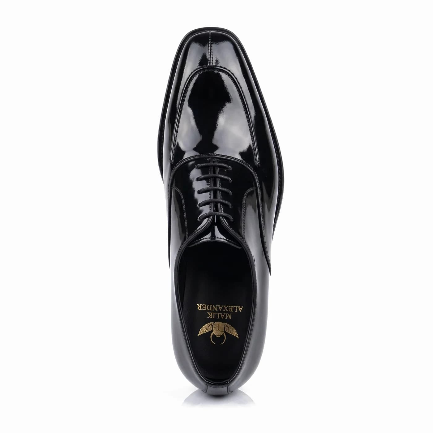 Split toe lace-up, black patent leather, from above, the Malik Alexander logo in gold on the black insole
