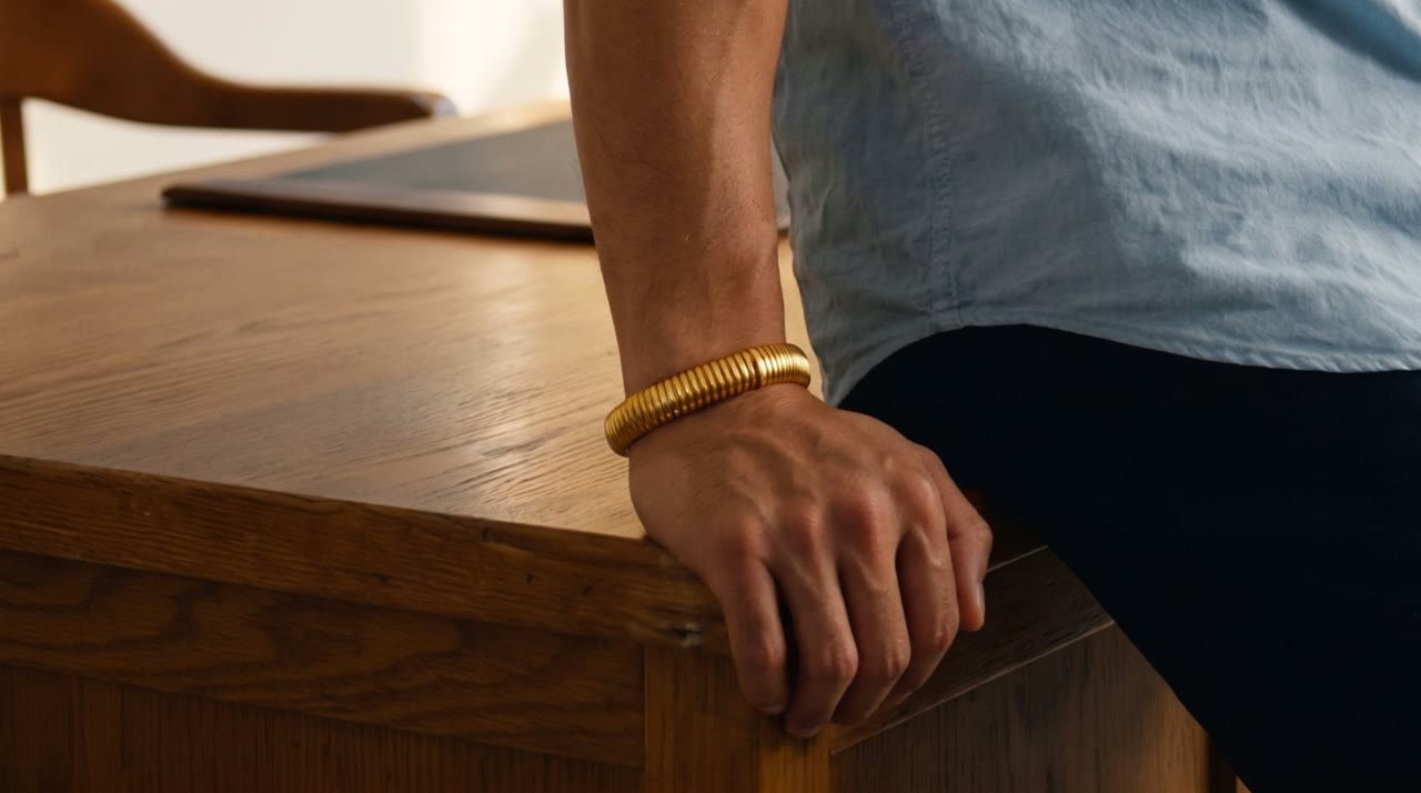 Luxor Coil Bangle worn in the scene