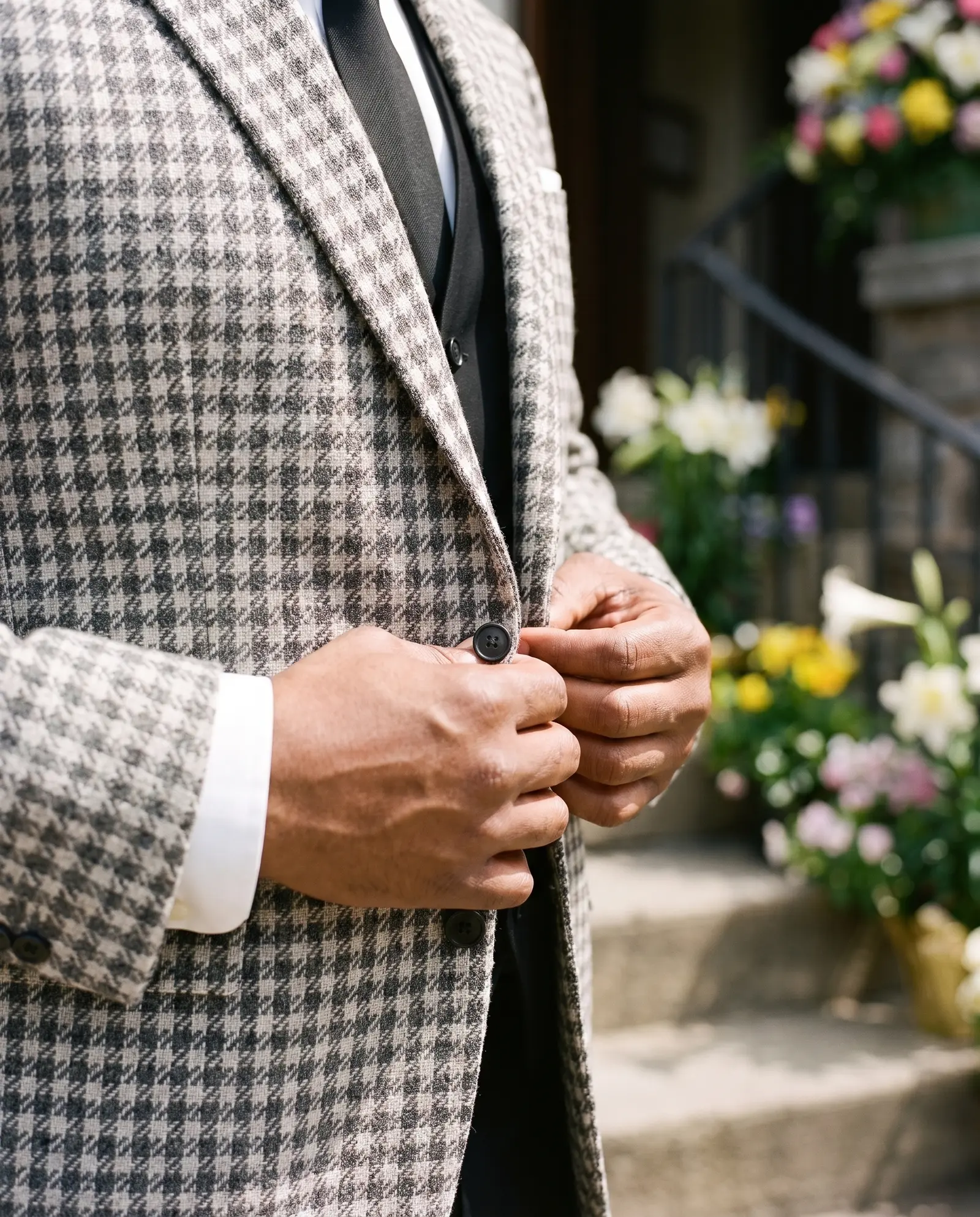 White and black houndstooth Levi three piece suit occasion photograph